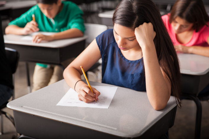 Group High School Students Taking Test Classroom 706x471
