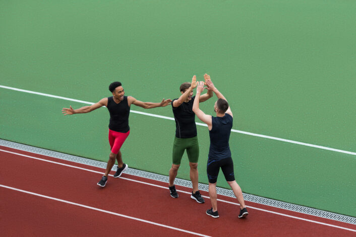 Multiethnic Athlete Team Standing Running Track 706x471